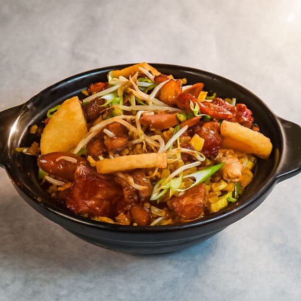 Ecuadorian chaufan, a fried rice dish with chicken, sausage, bean sprouts, and plantain fries.